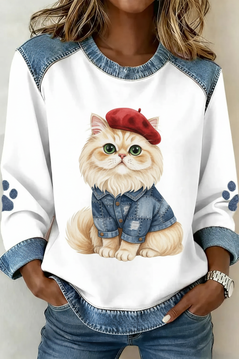 Kat met Franse beret en denim jasje