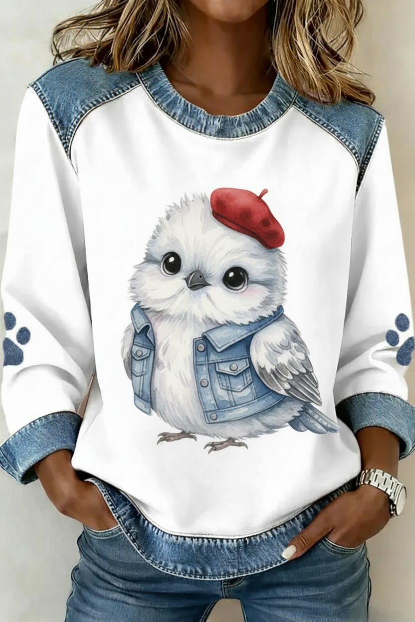 Vogel met Franse beret en denim jasje